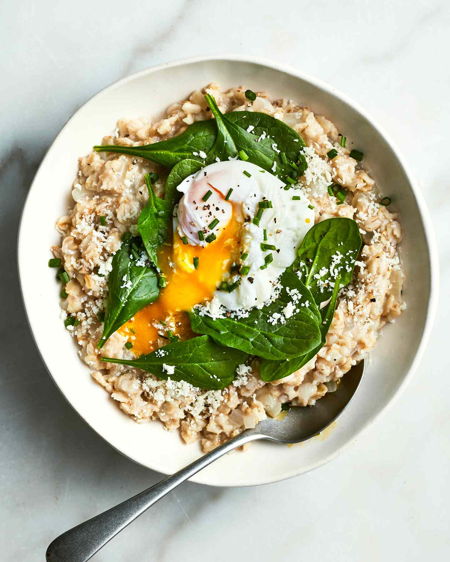 A savory oatmeal with egg and spinach is the breakfast you didnât know you needed in your life. Get the recipe for Savory Oatmeal With Spinach and Poached Eggs.