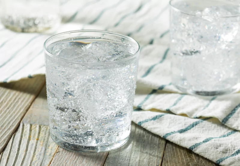 a glass of ice cold mineral water