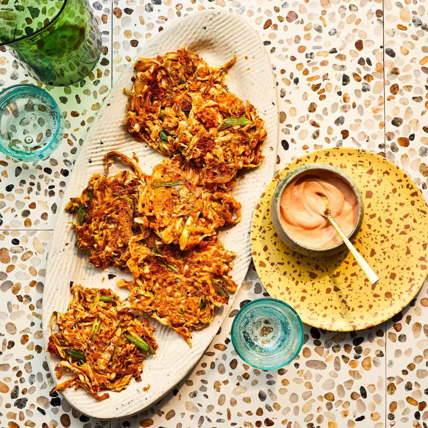 Here's a tasty way to transform a head of cabbage into a satisfying meal: Shred and toss it with spicy chopped kimchi and some eggs to make crispy cakes.