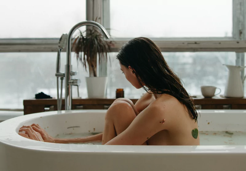 a girl taking a warm bath