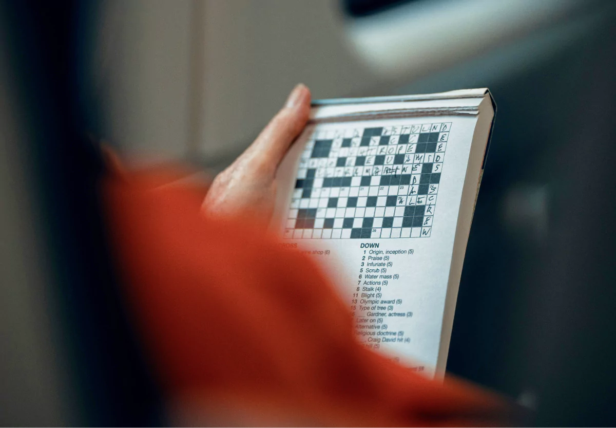 someone doing a crossword puzzle